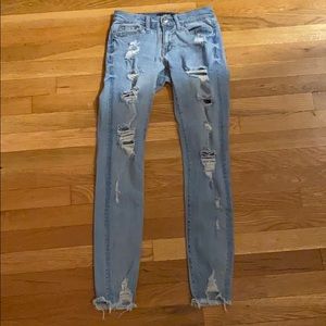 Low rise aero blue ripped jeans